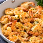 Delicious garlic butter shrimp sautéed in a rich lemon sauce, ready to serve.
