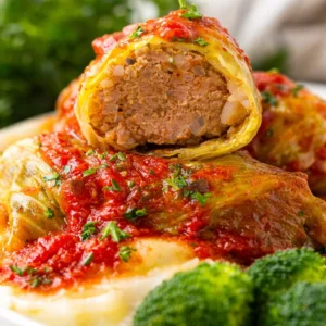 Delicious stuffed cabbage rolls filled with beef and rice in tomato sauce.
