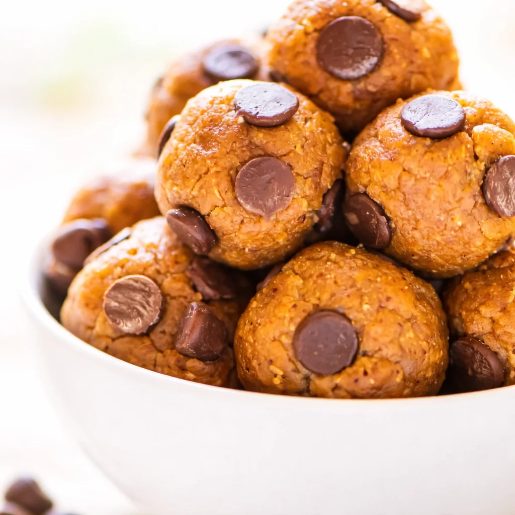 No-Bake Peanut Butter Low Carb Protein Balls - Plate of delicious no-bake low carb protein balls made with peanut butter and chocolate.