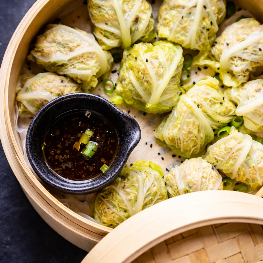 Delicious Cabbage Dumpling Recipe You’ll Want to Try Today 1 Pork cabbage dumplings served on a plate with dipping sauce